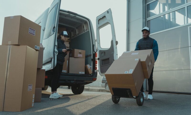 a man and a woman working for a delivery company