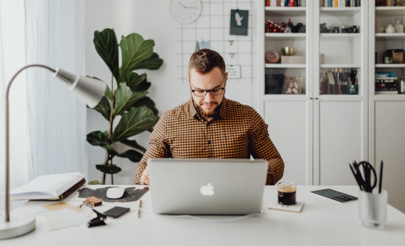 man working from home on laptop