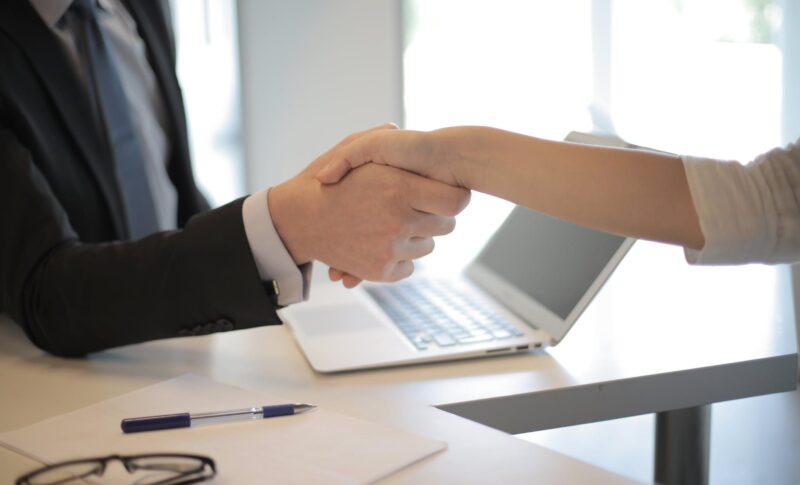 person in black suit hired an employee